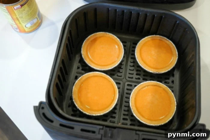 Easy Mini Pumpkin Pie Recipe 6 Close-up of an individual mini pumpkin pie, freshly baked and ready to be enjoyed.