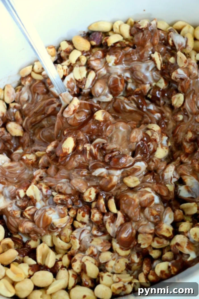 Easy Slow Cooker Peanut Clusters 6 Slow cooker peanut clusters on parchment paper, ready to set