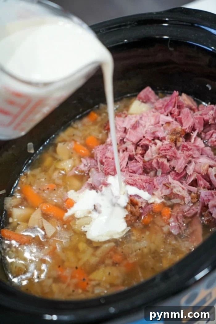 Hearty Slow Cooker Ham and Potato Soup 6 Delicious ham and potato soup in a serving bowl, ready to eat.