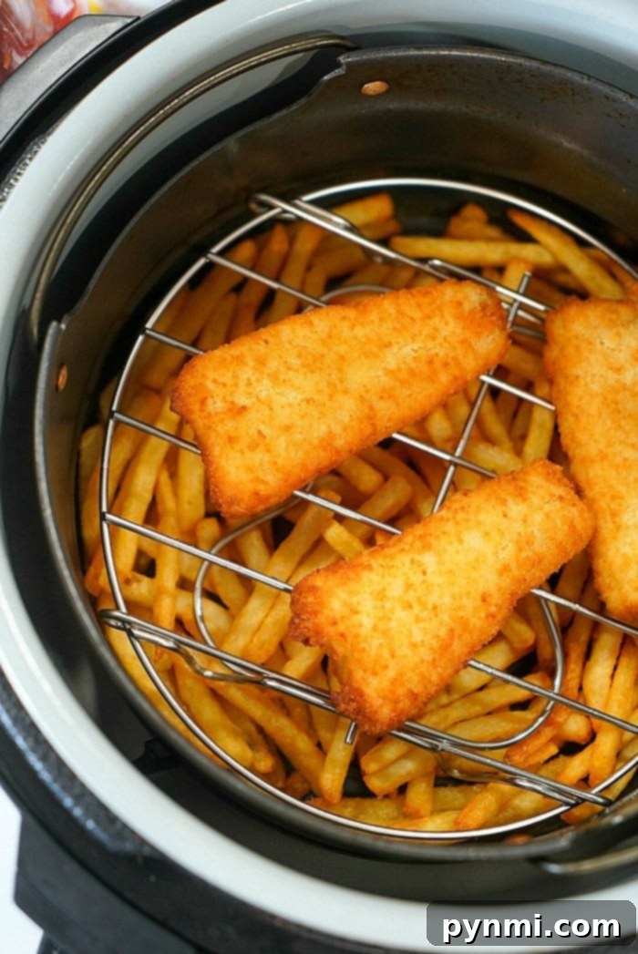 Crispy Air Fryer Fish and Chips 2 Crispy air fryer fish and chips, freshly cooked and ready to serve.