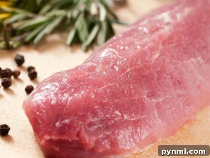 turkey tenderloin - Raw turkey tenderloins seasoned and ready for the Instant Pot, alongside fresh onions and broth.