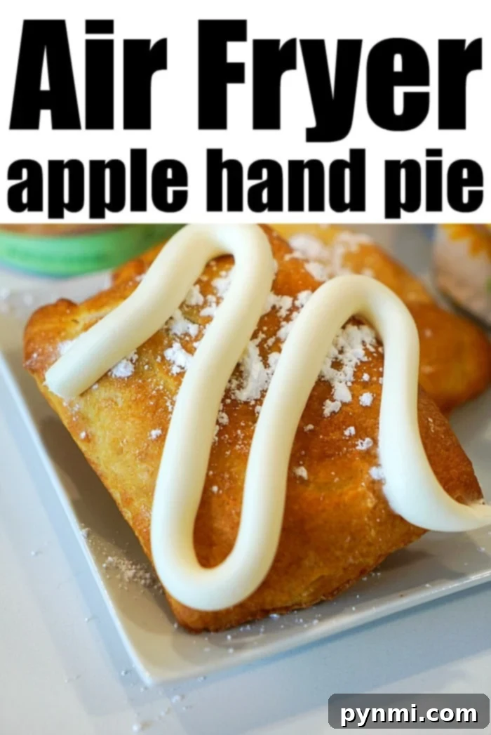 A close-up of an air-fried apple hand pie with icing drizzled on top, reminiscent of sweet air fryer dumplings.