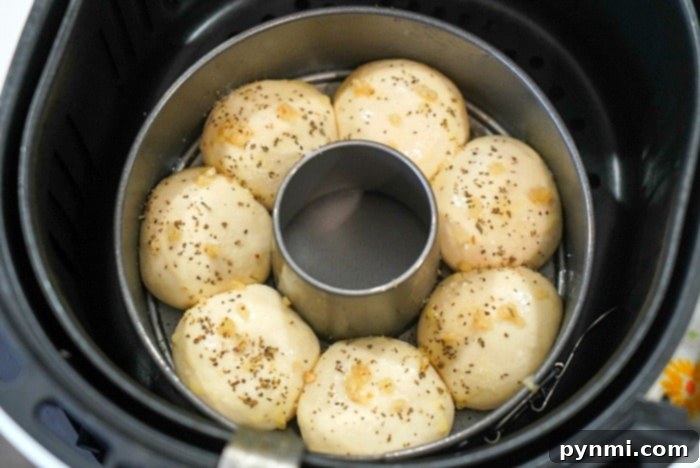 Perfectly Crispy Air Fryer Frozen Rolls 6 Freshly baked air fryer rolls, golden brown and perfectly puffed, ready for garlic butter.