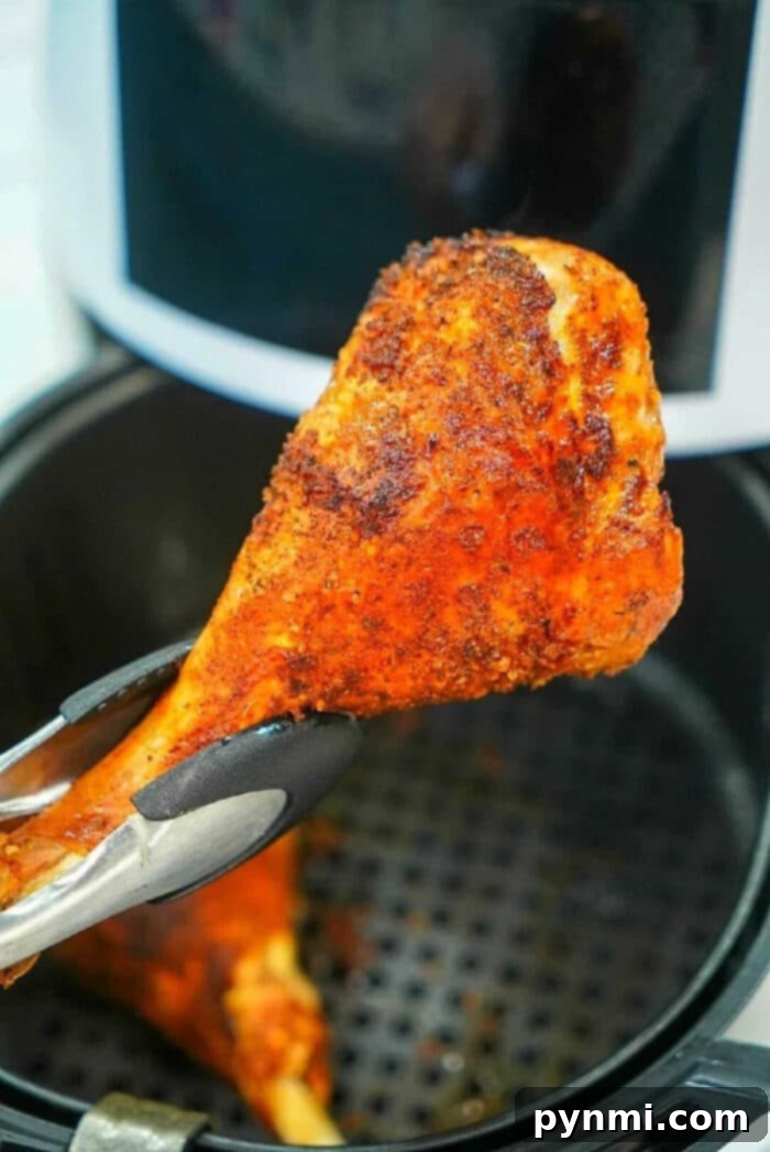 Golden-brown, perfectly seasoned air fryer turkey legs ready to be served