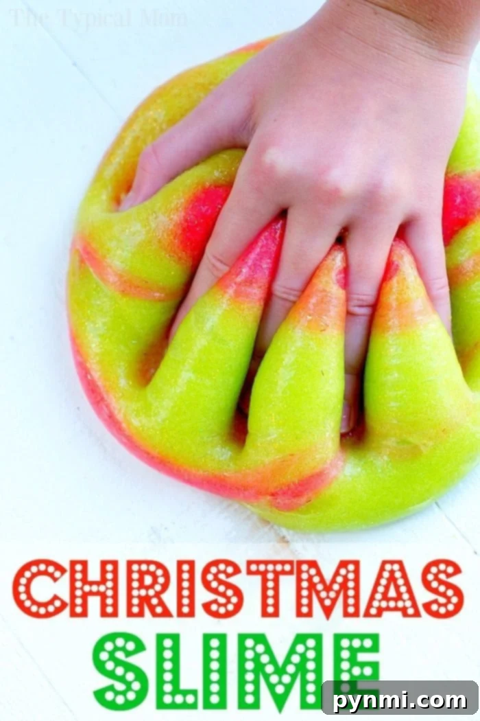 Vibrant Christmas slime, a perfect hands-on activity and stocking stuffer for creative kids. Christmas themed slime being stretched