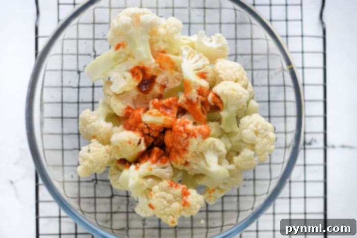Panko Crusted Air Fryer Buffalo Cauliflower Wings 5 A vibrant bowl of air-fried buffalo cauliflower wings, perfectly seasoned and ready for serving.