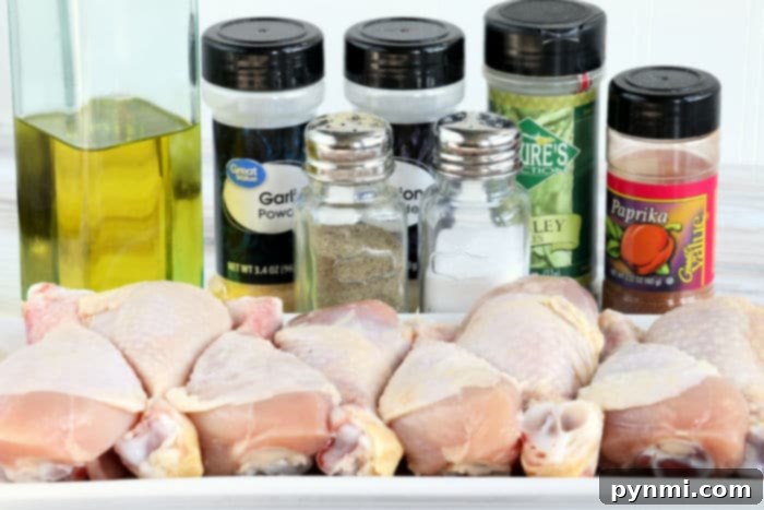 Fall-Off-The-Bone Slow Cooker Chicken Legs 4 Seasoned chicken legs in a crockpot, ready for slow cooking.