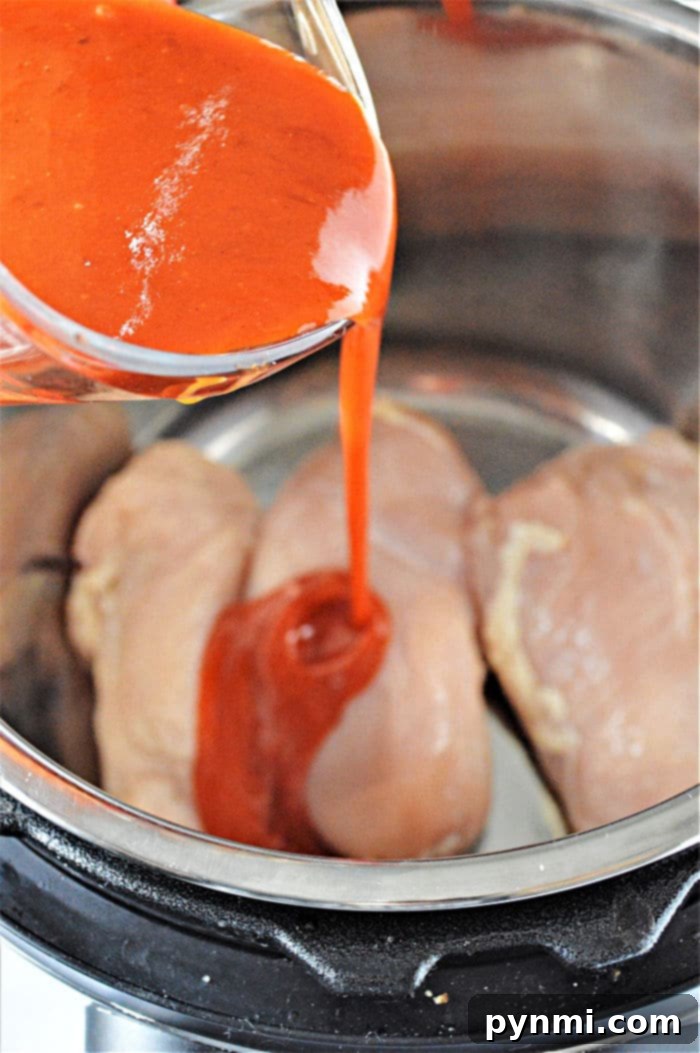 Instant Pot Buffalo Chicken Thighs with a rich, spicy sauce
