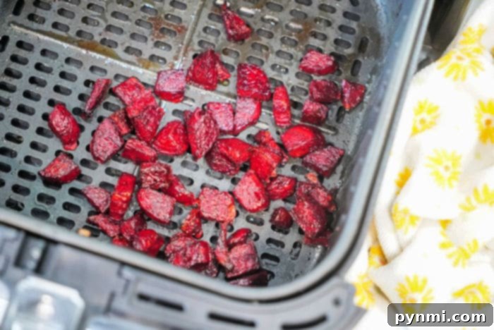 Sweet and Tender Air Fryer Beets 6 Air fryer basket filled with cooked, diced red beets