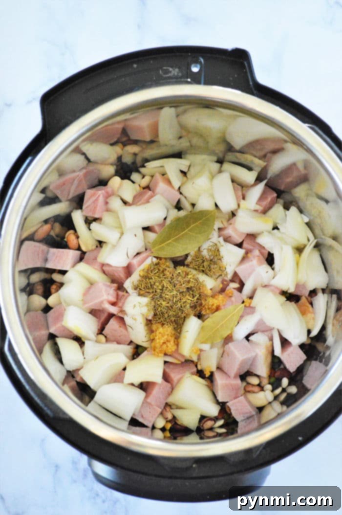 Ultimate Instant Pot 15-Bean Comfort 8 15 Bean Soup in Instant pot, simmering and ready.