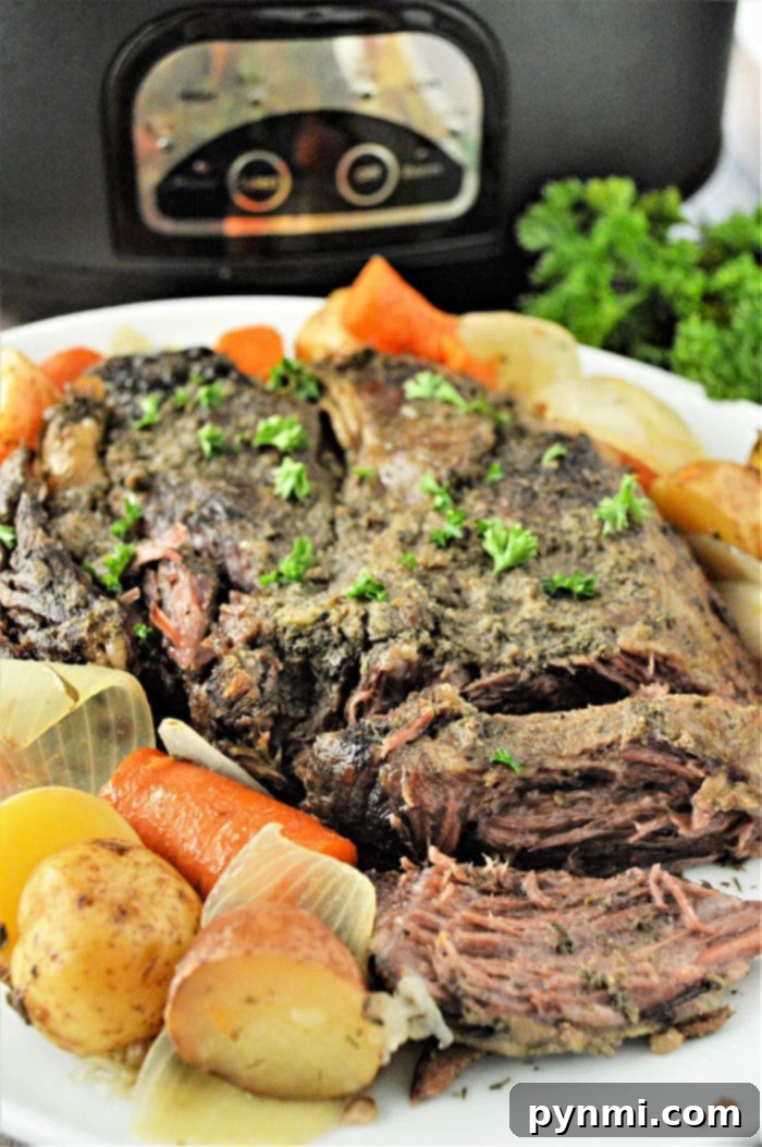 No Thaw Slow Cooker Pot Roast 2 A succulent slow cooker pot roast with tender vegetables and rich gravy, ready to serve.
