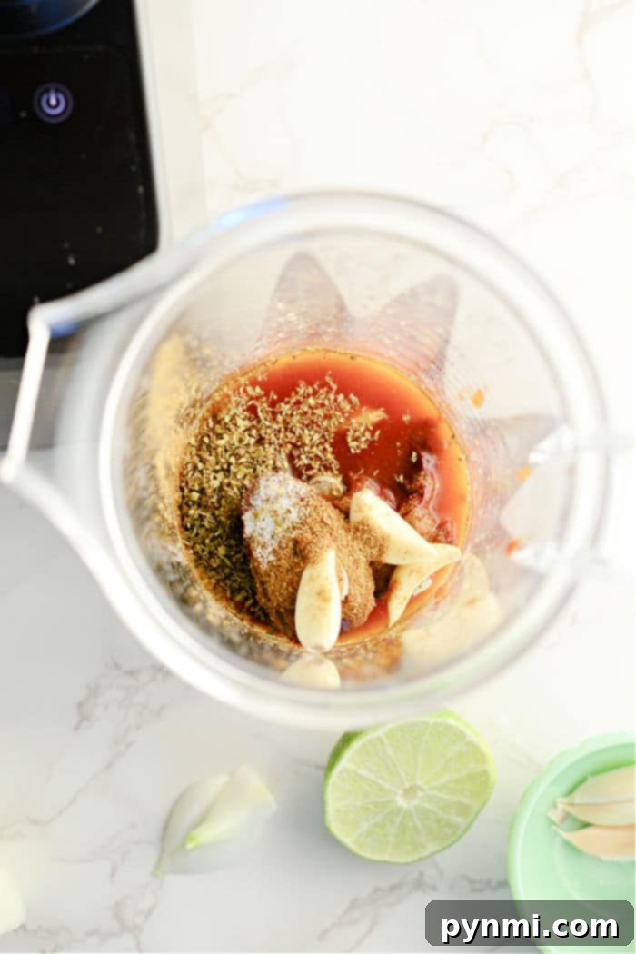 Mouthwatering Instant Pot Barbacoa 5 Barbacoa Sauce – a rich, reddish-brown barbacoa sauce simmering in a pot, ready to coat the tender shredded beef.