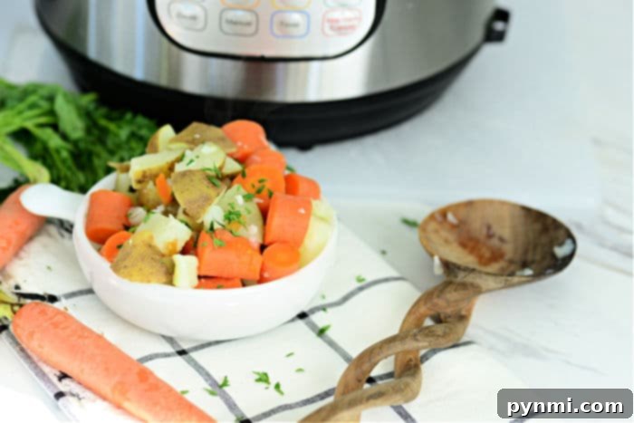 Easy Instant Pot Potatoes and Carrots 6 Ninja Foodi carrots and potatoes served with fresh herbs