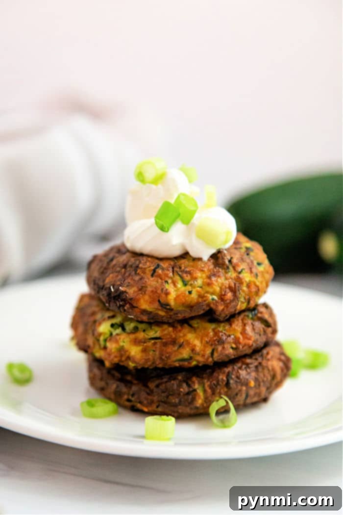 Crispy Air Fryer Zucchini Delights 7 Air fryer zucchini fritters recipe, golden brown and perfectly cooked.