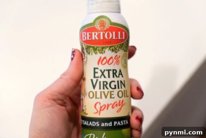 Olive Oil Magic: Enhancing Your Hair and Your Meals 6 An olive oil spray bottle for cooking, offering convenience and portion control.