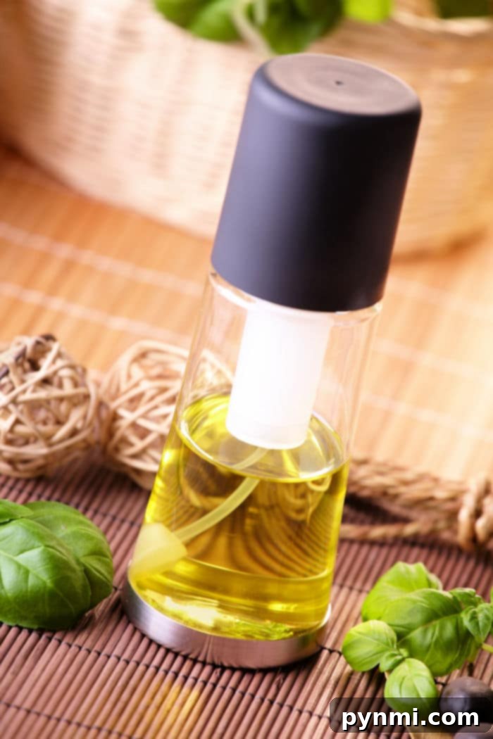 Olive Oil Magic: Enhancing Your Hair and Your Meals 7 A specialized olive oil spray bottle for even application in cooking and beauty.