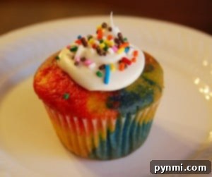 Colorful Rainbow Cupcakes with white frosting for St. Patrick's Day