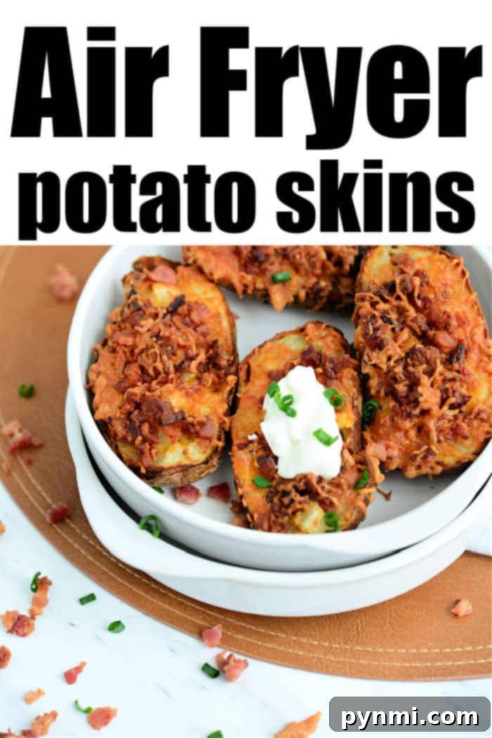 ninja foodi potato skins - A close-up of a filled air fryer potato skin, showcasing the melted cheese and bacon, alongside more potato skins in a serving dish.
