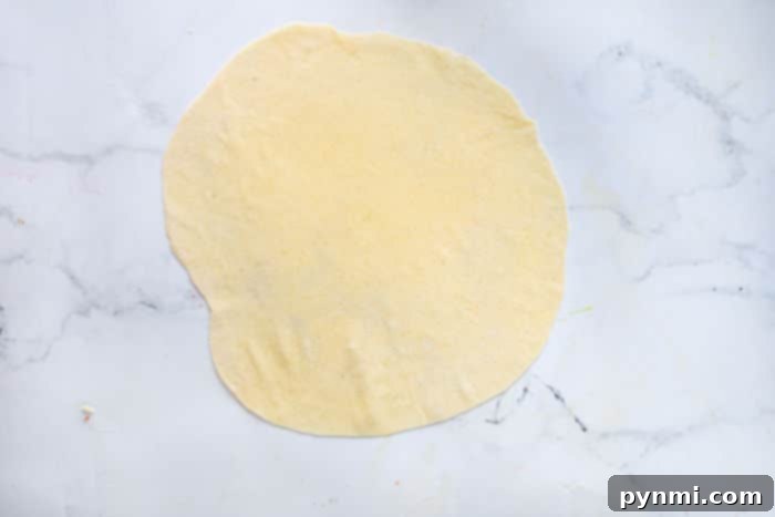 Crispy Homemade Egg Roll Wrappers from Scratch 4 Egg roll dough formed into a ball ready for rolling