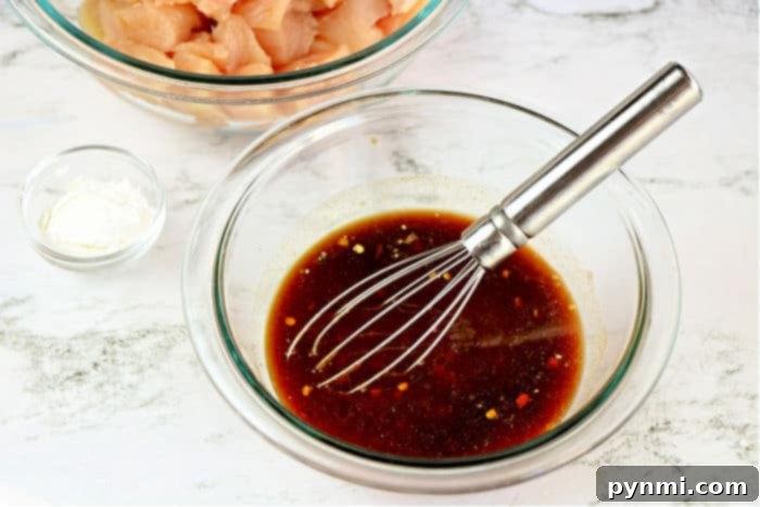 Flavorful Asian Chicken 5 Rich, glossy General Tso's style sauce simmering in the Instant Pot, ready to thicken.