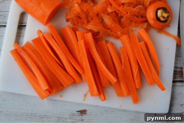 Crispy Air Fryer Carrot Fries 3 Freshly cut carrot sticks ready for air frying