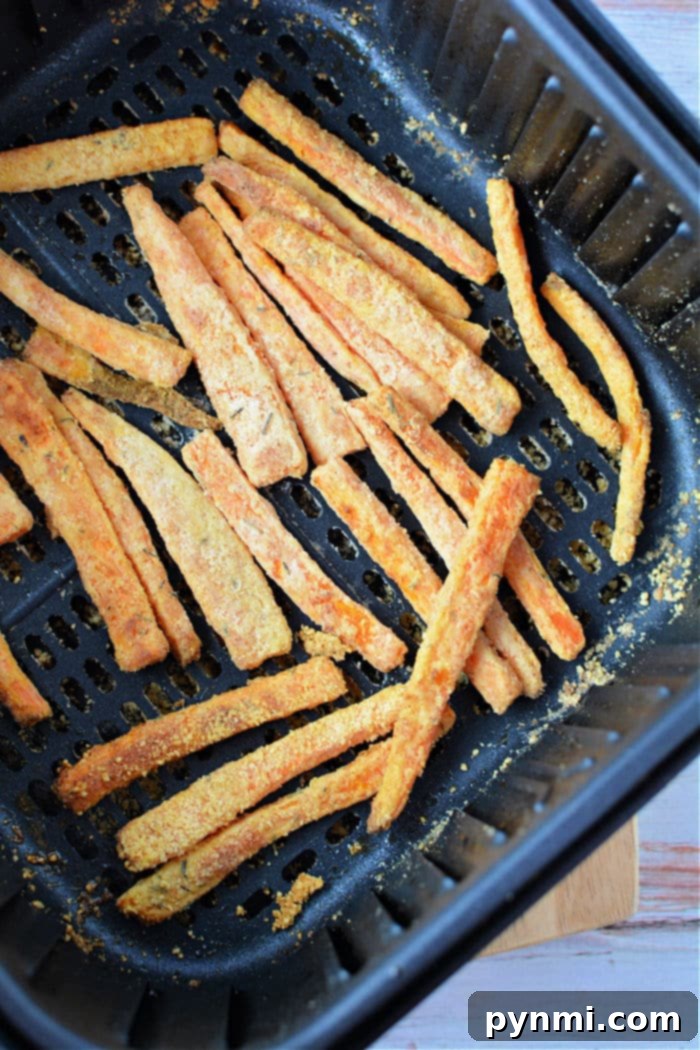 Crispy Air Fryer Carrot Fries 6 Plate of golden brown air fried carrots, ready to eat