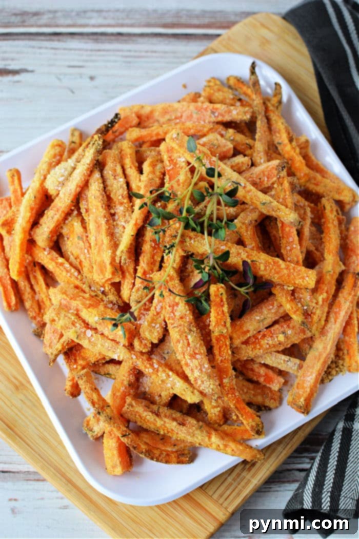 Crispy Air Fryer Carrot Fries 7 A basket full of golden air fryer carrot fries, ready to be served