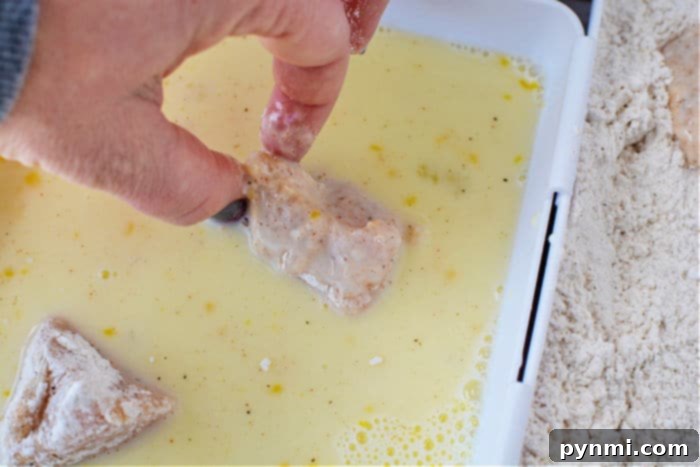 Crispy Homemade Air Fryer Chicken Nuggets 4 Ninja Foodi preparing chicken nuggets for air frying.
