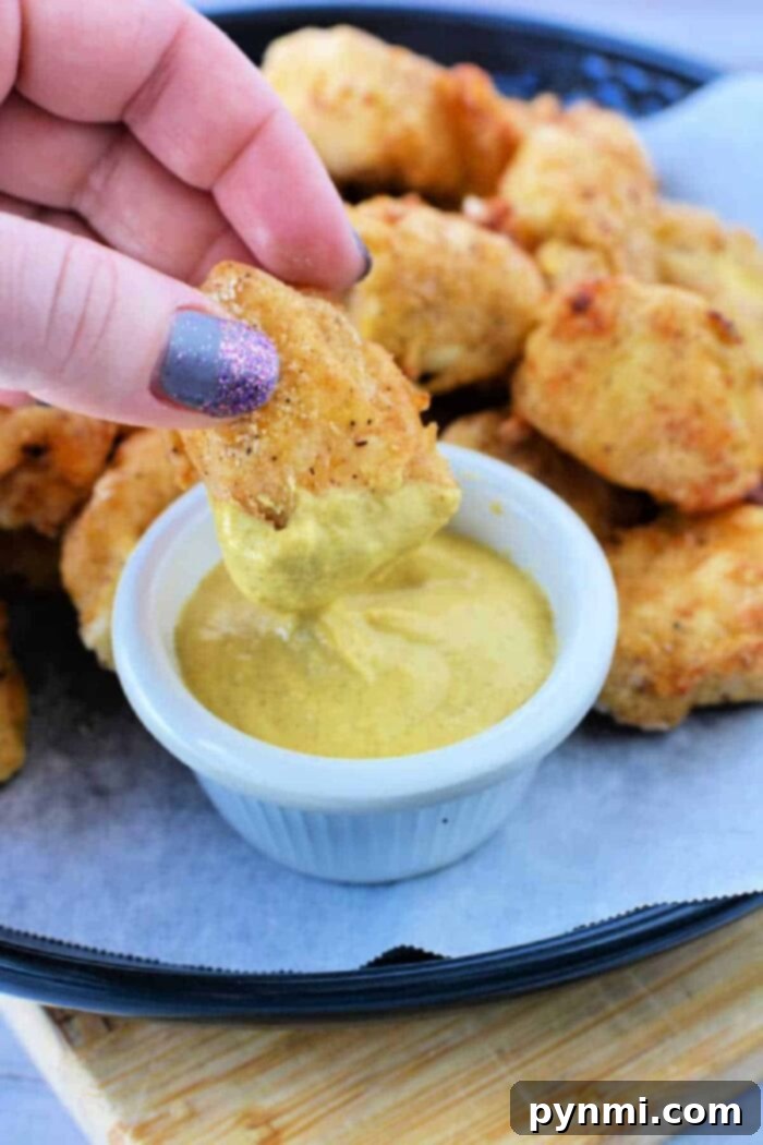 Crispy Homemade Air Fryer Chicken Nuggets 9 A large plate of homemade air fryer copycat chicken nuggets, ready to be enjoyed.