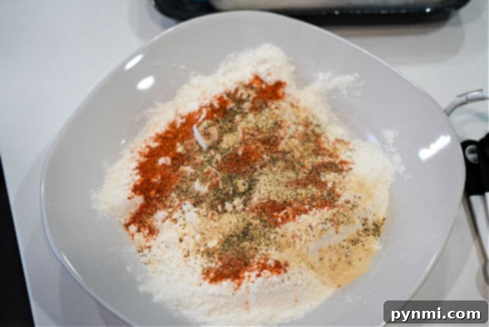 Golden Air Fryer Fish Bites 5 Bowls of flour, whisked egg, and seasoned flour for breading fish nuggets.