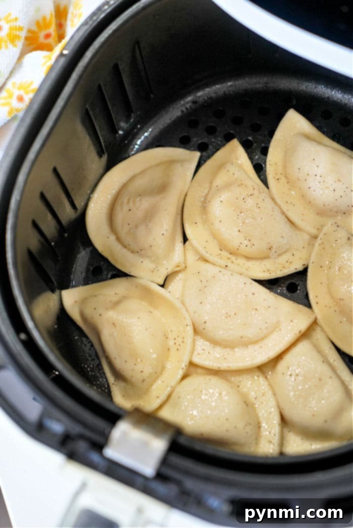Perfectly air-fried pierogies arranged in a basket, showing off their golden-brown color.