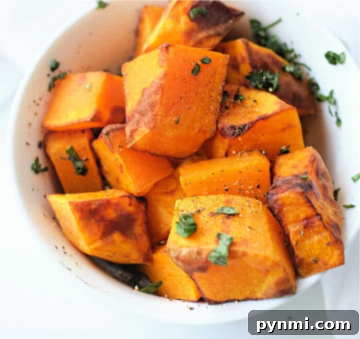 Golden Air-Fried Butternut Squash 2 Butternut Squash in a Ninja Foodi air fryer basket, ready to cook.
