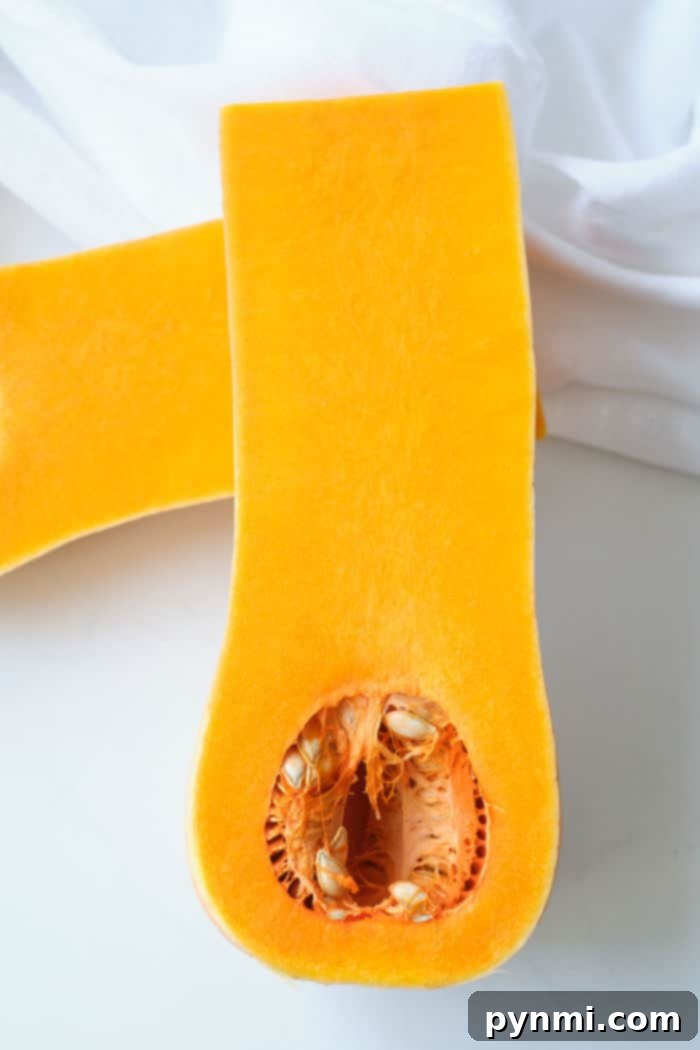 Golden Air-Fried Butternut Squash 3 Whole butternut squash on a cutting board, ready for preparation.