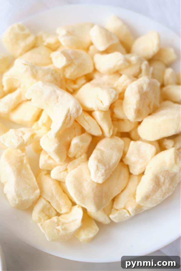 Golden Crispy Air Fryer Cheese Curds 3 Close-up of cheese curds before air frying, showing their irregular shape.