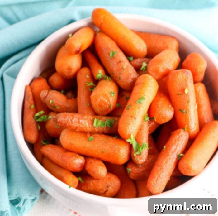 Effortless Crockpot Carrots 8 Close up of a bowl of delicious Crockpot carrots recipe, ready to be enjoyed.