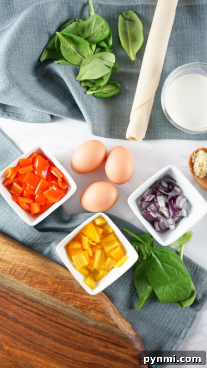 Vibrant Bell Pepper Breakfast Quiche 3 Fresh ingredients for a bell pepper quiche, including bell peppers, spinach, and eggs
