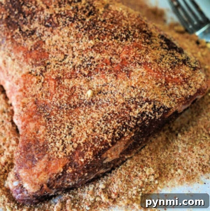 Ultimate Tri-Tip Seasoning 2 Flavorful Tri-Tip Dry Rub Coating a Raw Cut of Beef