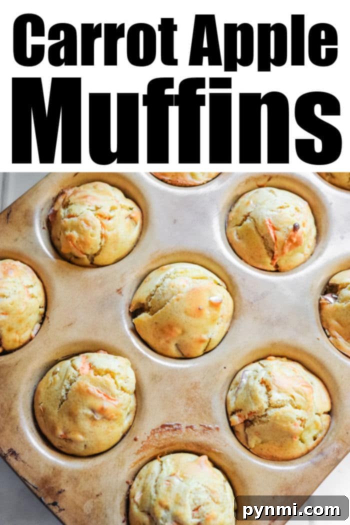 Wholesome Apple Carrot Muffins 5 Baked Apple Carrot Muffin recipe on a cutting board, ready to be enjoyed.