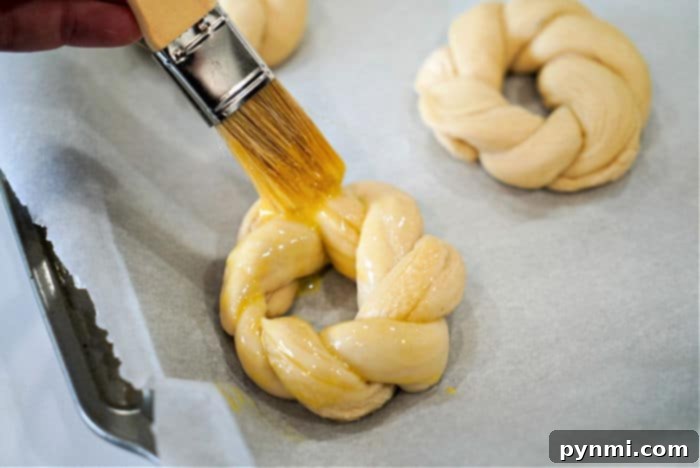 Golden Easter Egg Brioche 8 Applying Egg Wash to Easter Bread