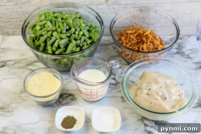 Various ingredients for a green bean casserole, neatly arranged on a counter.
