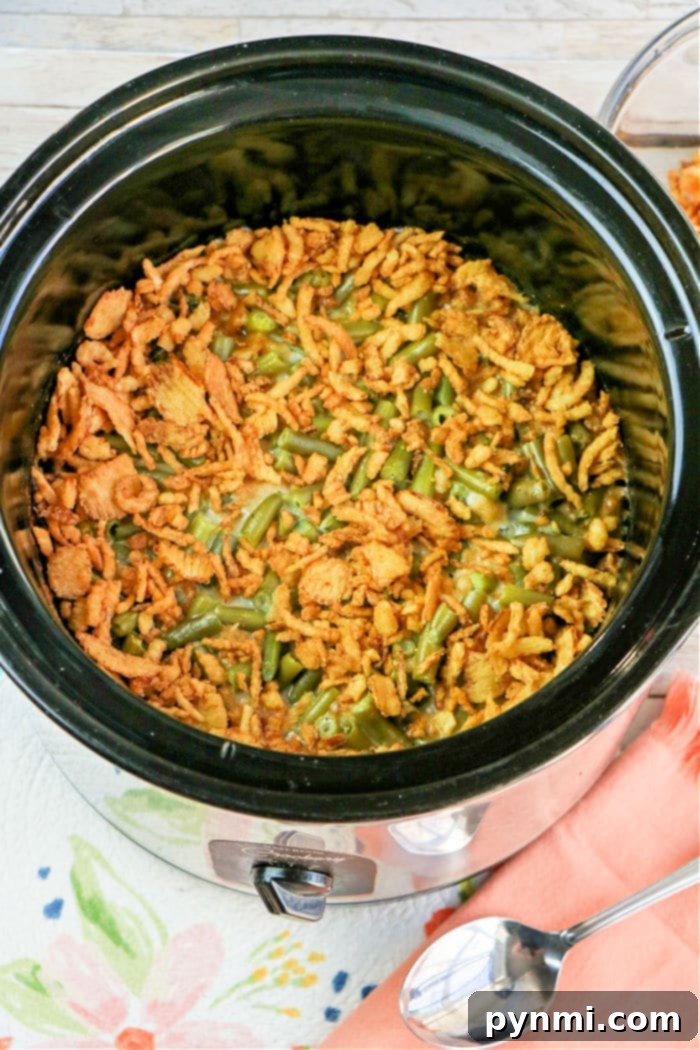 Green Bean Casserole cooking in a slow cooker, close up.