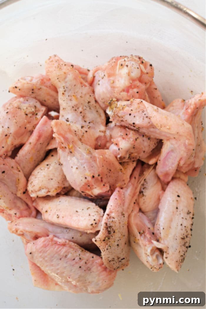Platter of perfectly cooked chicken wings, ready to be served.