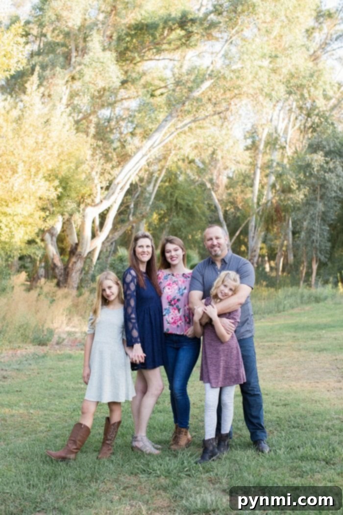 Family enjoying a photoshoot with personalized props in Temecula