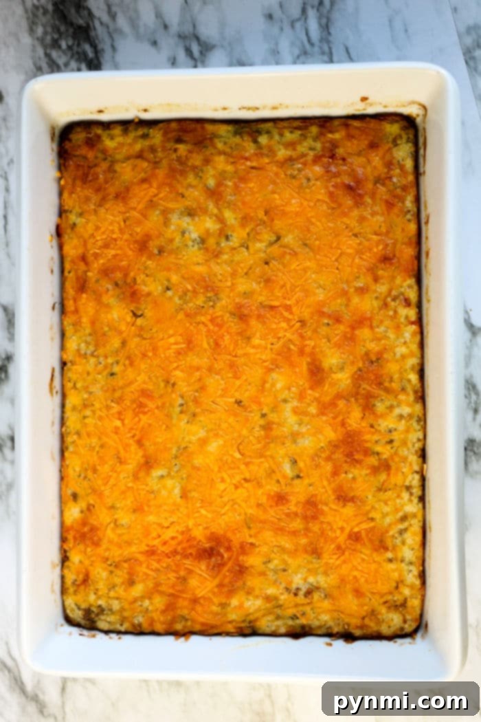 Ultimate Cheesy Grits Bake 5 Hearty Southern Cheese Grits Casserole baked to a golden brown, ready for serving.