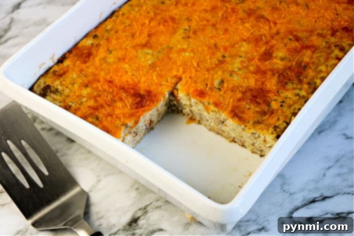 Ultimate Cheesy Grits Bake 8 Savory Sausage Casserole with grits, baked to perfection and ready to serve for breakfast or brunch.