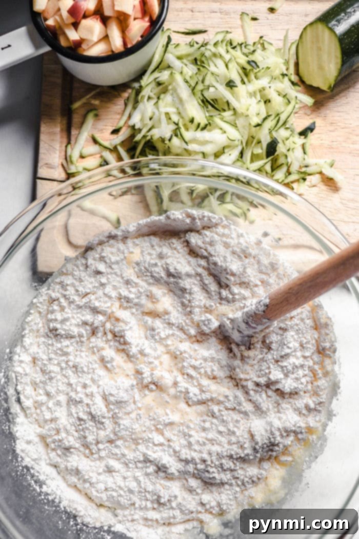 Prepared shredded zucchini with absorbed moisture on paper towels