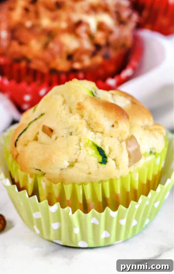 Close-up of golden-brown zucchini muffins