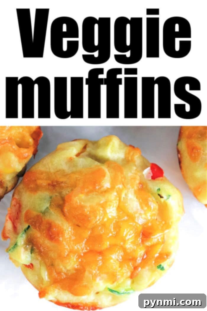 Cheesy Herb Zucchini Muffins 8 Several savory vegetable muffins arranged on a white serving plate. Each muffin is golden brown, showing visible pieces of green zucchini, red bell pepper, and yellow corn, with a slight golden crust on top. The presentation suggests a fresh, healthy, and delicious homemade snack.
