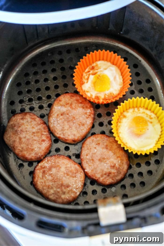 A delicious air fryer breakfast with sausage patties and eggs.