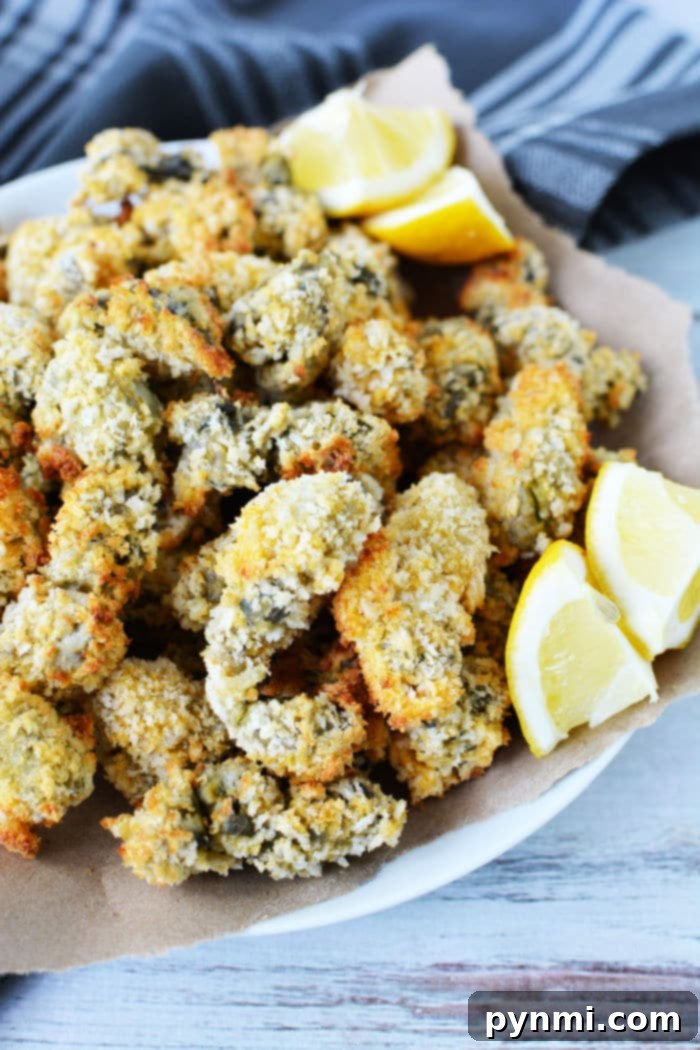Crispy Air Fryer Oysters 2 Crispy Panko Breaded Air Fryer Oysters, golden brown and ready to eat.